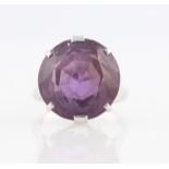 An amethyst dress ring, set with a round cut amethyst, measuring approx. 16mm, stamped 9ct, ring