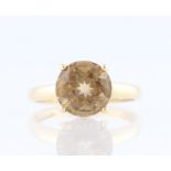 A 9ct yellow gold citrine ring, set with a central round cut citrine, hallmarked Birmingham, date