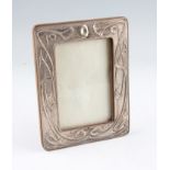 An early 20th Century Art Nouveau silver fronted photograph frame, hallmarked Birmingham 1908,