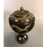 A goblet shaped cloisonne pot with lid, decorated with dragons and flowers, approximately 22 cm
