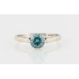A blue zircon single stone ring, set with a round cut blue zircon, stamped 9ct, ring size N.