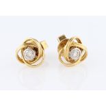 A pair of diamond stud earrings, each set with a round brilliant cut diamond, each measuring approx.