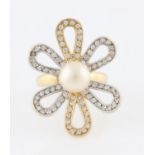 A pearl and cubic zirconia flower design dress ring, stamped 585, ring size M½.