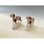 A pair of porcelain dogs panting