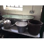 A galvanised bath, watering can and two buckets