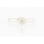 An 18ct white gold diamond solitaire ring, set with a round brilliant cut diamond, measuring approx.