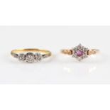 A three stone diamond ring, set with three graduated diamonds, two rose cut and one eight-cut,