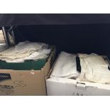 Several boxes of various linens and blankets