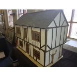 A large dolls house, with various interior furniture.