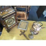 A mantle clock together with a copper kettle, a frame and two crucifixes.