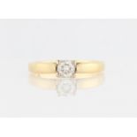 An 18ct yellow gold diamond solitaire ring, set with a central round brilliant cut diamond,