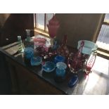 A collection of various coloured glassware