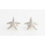 A pair of Tiffany & Co. Peretti diamond starfish stud earrings, each set with sixteen graduated