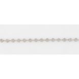 A diamond flower design bracelet, featuring seventeen diamond flower links, each measuring approx.
