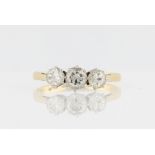 A three stone diamond ring, set with three graduated round brilliant cut diamonds, total diamond