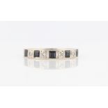 An 18ct white gold sapphire and diamond half eternity ring, set with five square cut sapphires and