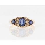 A hallmarked 9ct yellow gold sapphire ring, set with three graduated oval cut sapphires (possibly