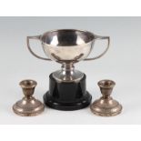 A hallmarked silver trophy, raised on a plastic base, together with a pair of hallmarked silver