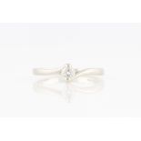 A platinum diamond solitaire ring, set with a round brilliant cut diamond, measuring approx. 0.25ct,