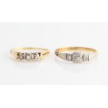 Two three stone diamond rings, both stamped 18ct, ring sizes N and Q, (2).