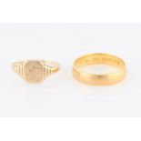 A 22ct yellow gold wedding band, hallmarked Birmingham 1929, together with a signet ring, engraved