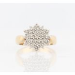 A 9ct yellow gold diamond cluster ring, set with eight-cut diamonds in tiered flower design,