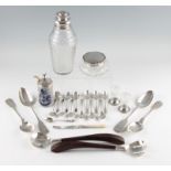 A collection of hallmarked silverware to include a silver topped glass dressing table pot, six