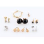 A collection of seven pairs of earrings and two single earrings, some being gemstone set.