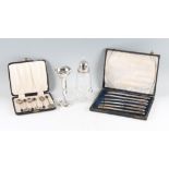 A boxed set of six hallmarked silver coffee bean spoons, a boxed set of six hallmarked silver