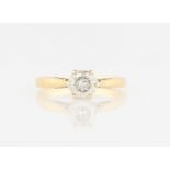 An 18ct yellow gold diamond solitaire ring, set with a round brilliant cut diamond, measuring