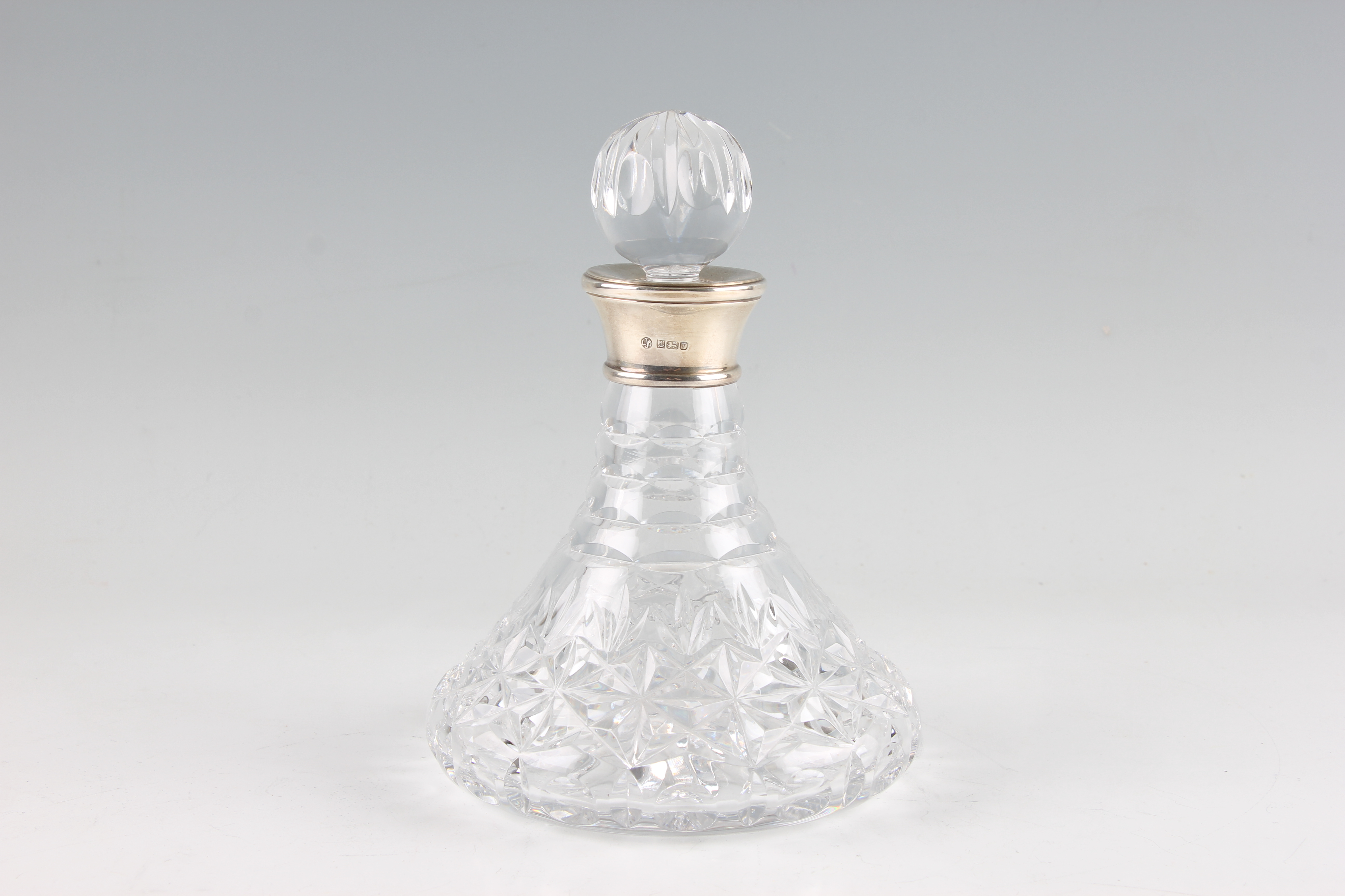 A silver collared glass decanter, silver hallmarked Birmingham 1993, with makers mark LJM for L J