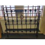A Victorian brass and iron double bed.