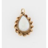 A 9ct yellow gold opal pendant, set with a pear shaped opal cabochon, with rope twist design border,