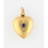 A 15ct yellow gold sapphire set heart pendant, star set with a central round cut sapphire,