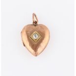 A 9ct yellow gold Victorian diamond set heart locket, set with an Old Mine cut diamond, measuring