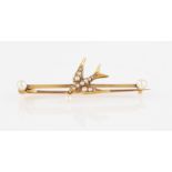 A seed pearl set swallow bar brooch, featuring a central seed pearl set swallow with pearl dropper
