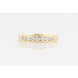 An 18ct yellow gold diamond seven stone half eternity ring, channel set with seven round brilliant