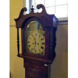 An oak and mahogany long cased clock with painted dial surround.