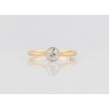 A diamond solitaire ring, bezel set with an Old European cut diamond, measuring approx. 0.40ct,