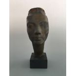 A mounted bronze bust of Nefertiti sculpted by Bernard Rice. Height 35cm.