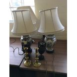 Two pairs of brass candlesticks and a pair of Spelter Grecian style urns.
