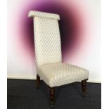 Prie Dieu chair, with cream upholstery.