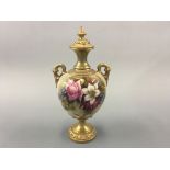 A Royal Worcester lidded urn, signed F J Bray. Height 26cm.