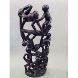 A hardwood erotic African sculpture.