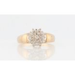 A 9ct yellow gold tiered diamond cluster ring, set with four tiers of round brilliant cut