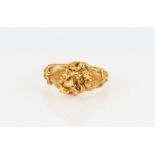 A nugget design ring, unmarked yellow metal, ring size N.