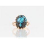 A 9ct yellow gold turquoise ring, set with an oval turquoise cabochon, hallmarked Chester 1925, ring