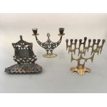 Two brass nine-lamp menorahs with a two-lamp candlestick holder with Star of David. Heights