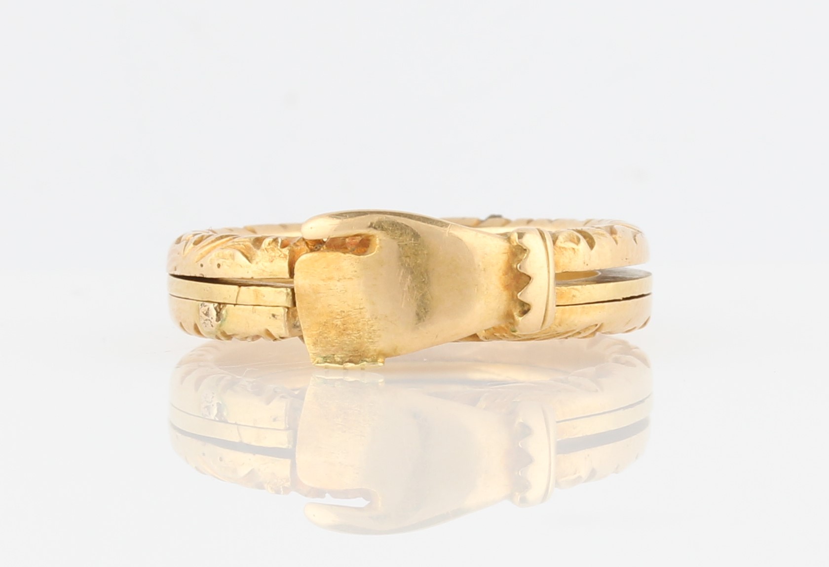 A gimmel ring, consisting of three linked bands, the outer two engraved with scroll design, bands