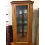 Teak corner display cabinet, hiding cabinet, fire screen and red rug.